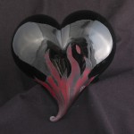 Hand blown black glass heart with red flames